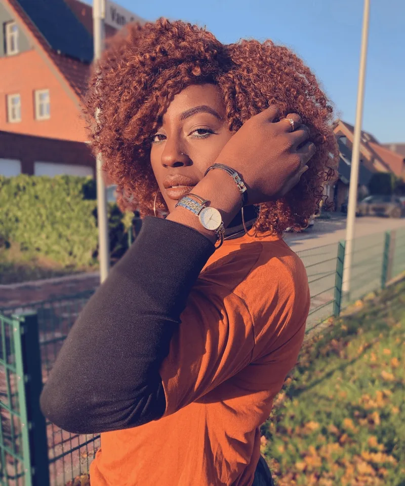 Creator Ayat Alassani wearing silver gold Small Edit Rosefield watch next to campaign results