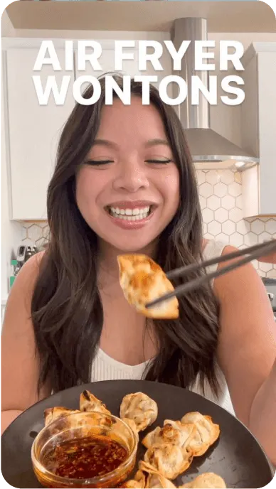 Instagram still of creator eating bibigo dumplings with text reading air fryer wontons