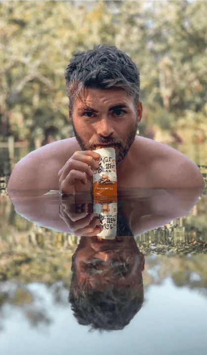 Campaign results next to image of a man eating a Clif Bar while swimming
