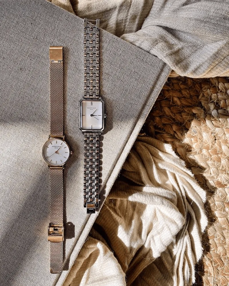 Flatlay of rose gold Small Edit and silver Octagon Rosefield watches