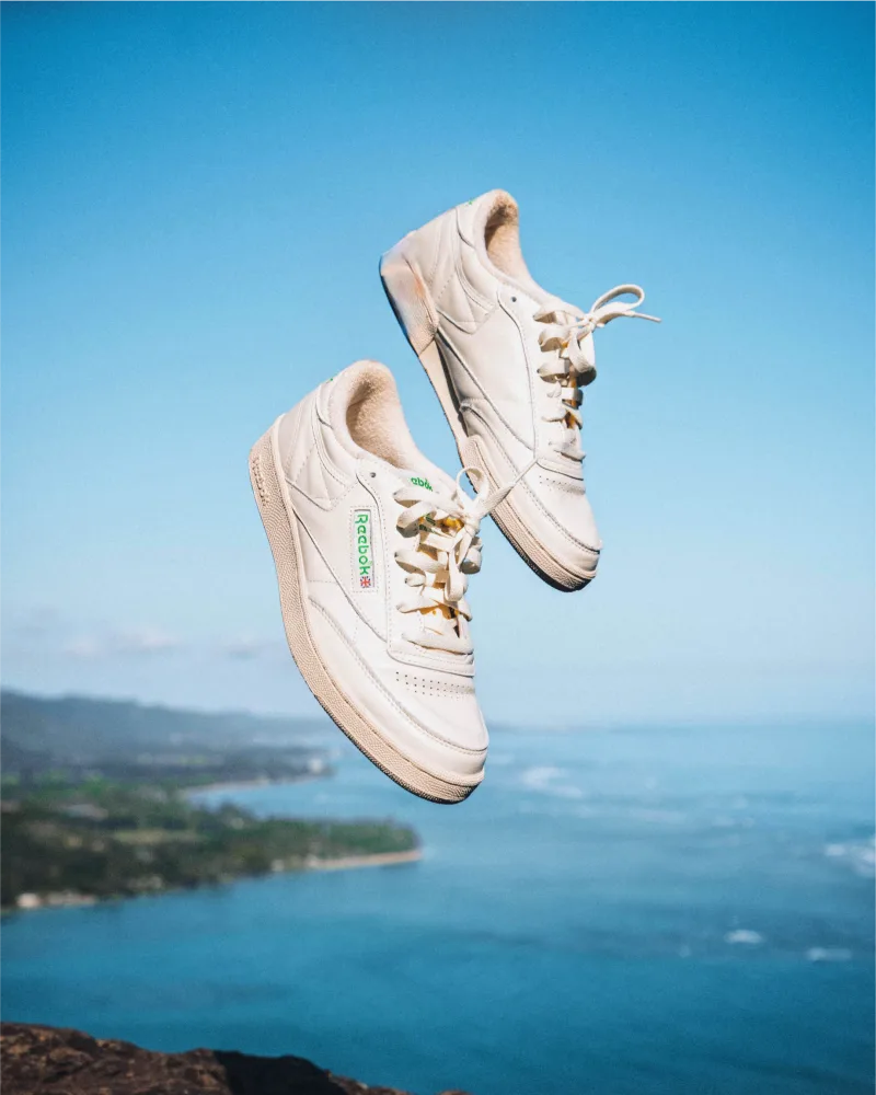 Reebok Club C shoes next to key campaign stats