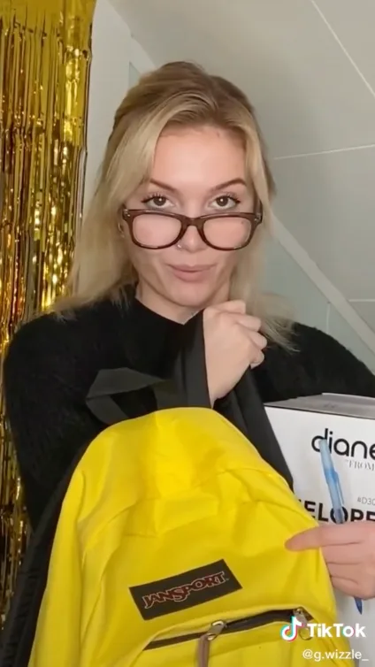 Still of TikTok from creator Gwizzle with a yellow JanSport backpack