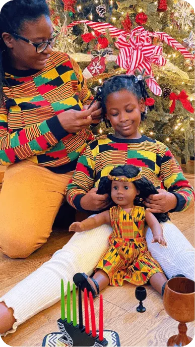 Family influencers playing with their American Girl dolls
