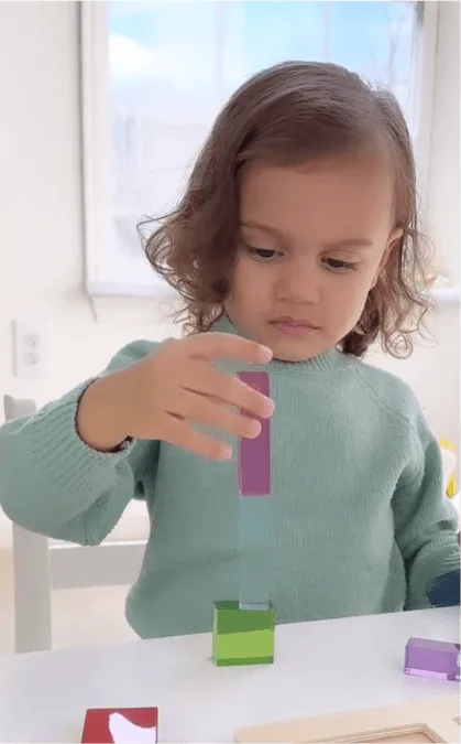 Child plays with wooden toy next to key campaign results