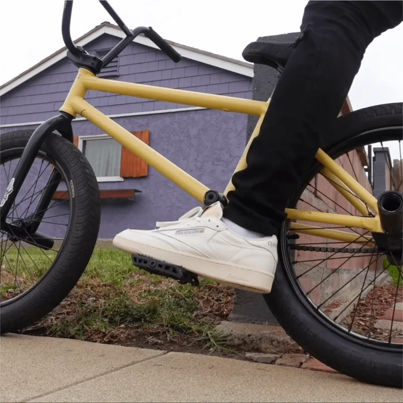 Creator on bike wearing Reebok shoes