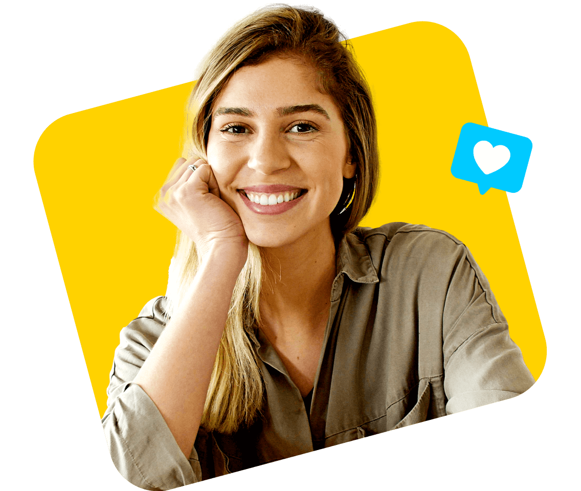 Woman smiles next to heart emoji