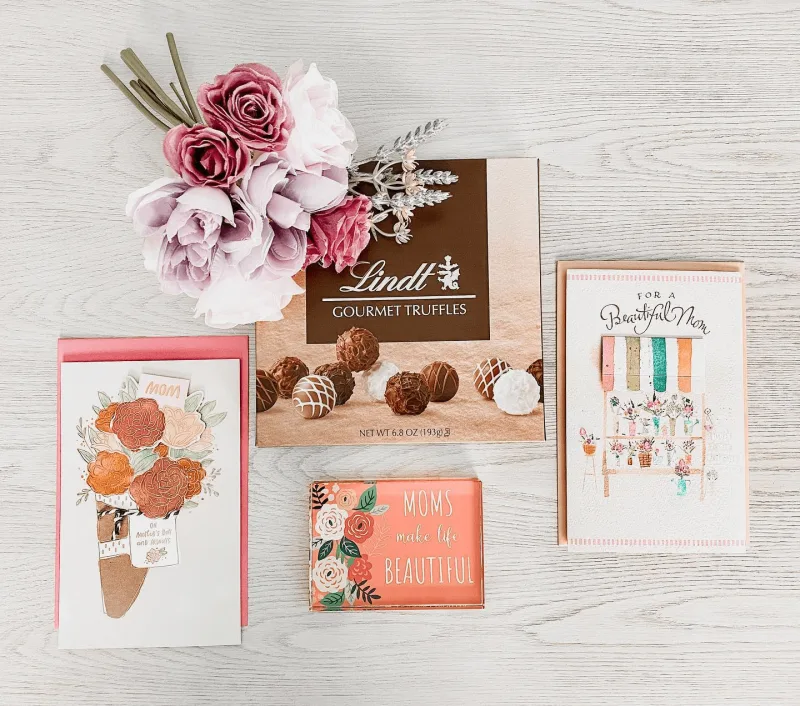 Key campaign stats and image of Lindt chocolate box and an American Greetings card