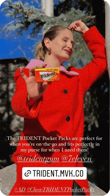Creator in red jacket poses with Trident pocket packs